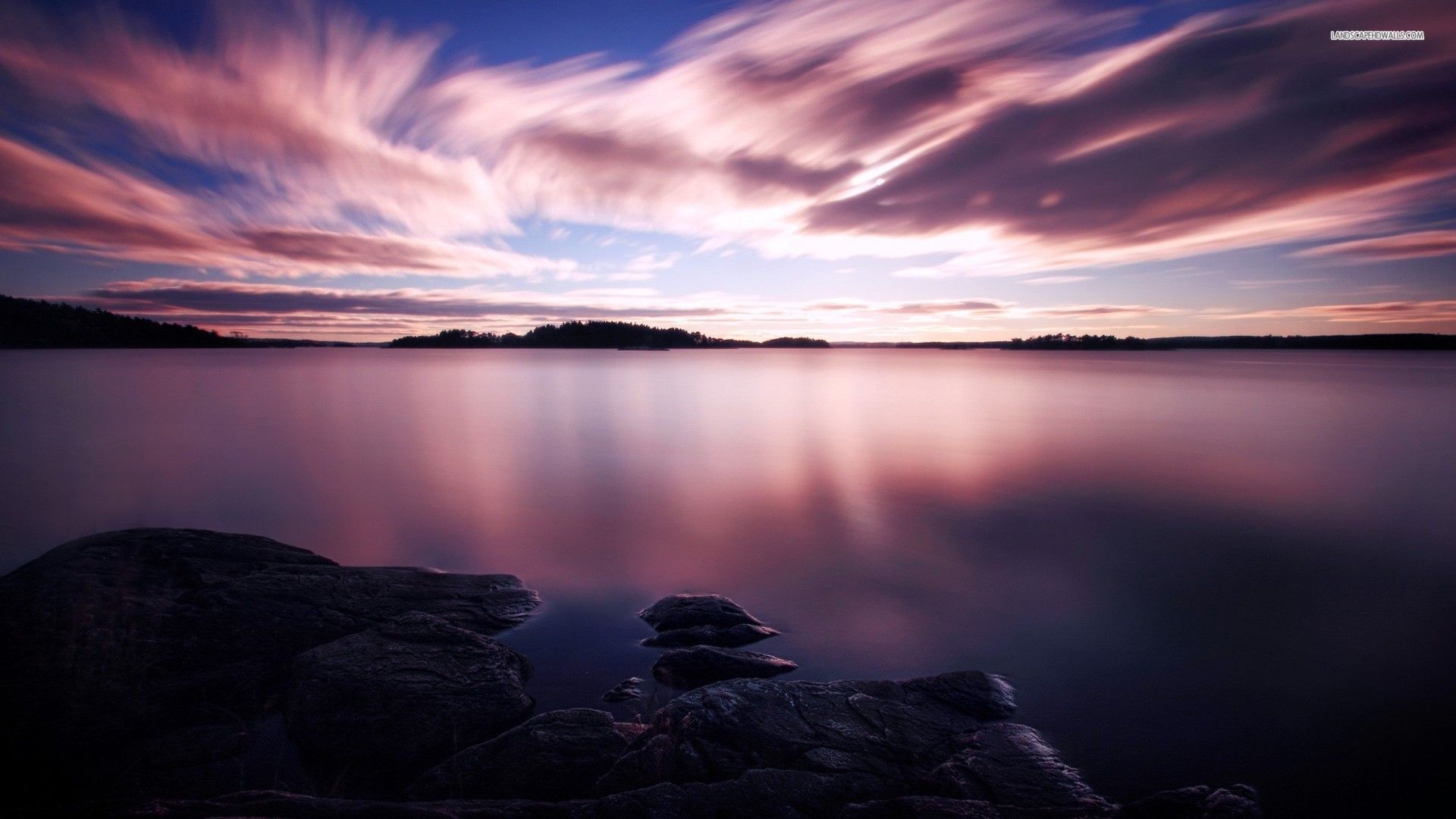 A Calm Lake At Sunset Wallpapers