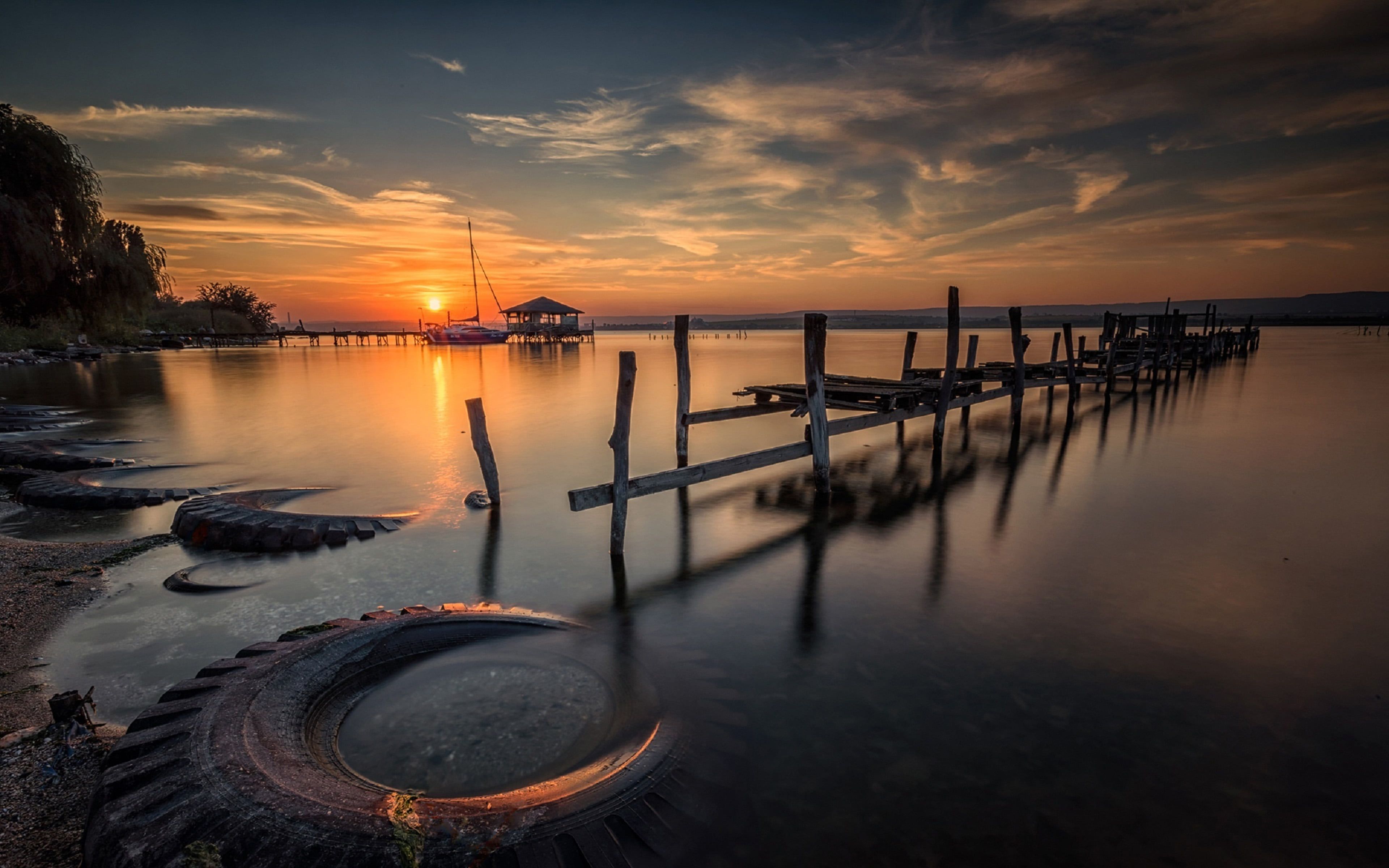 A Calm Lake At Sunset Wallpapers