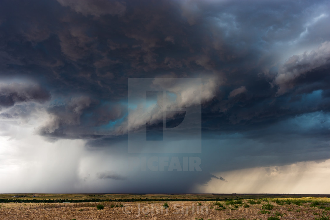 Dramatic Field Under Dark Clouds Wallpapers