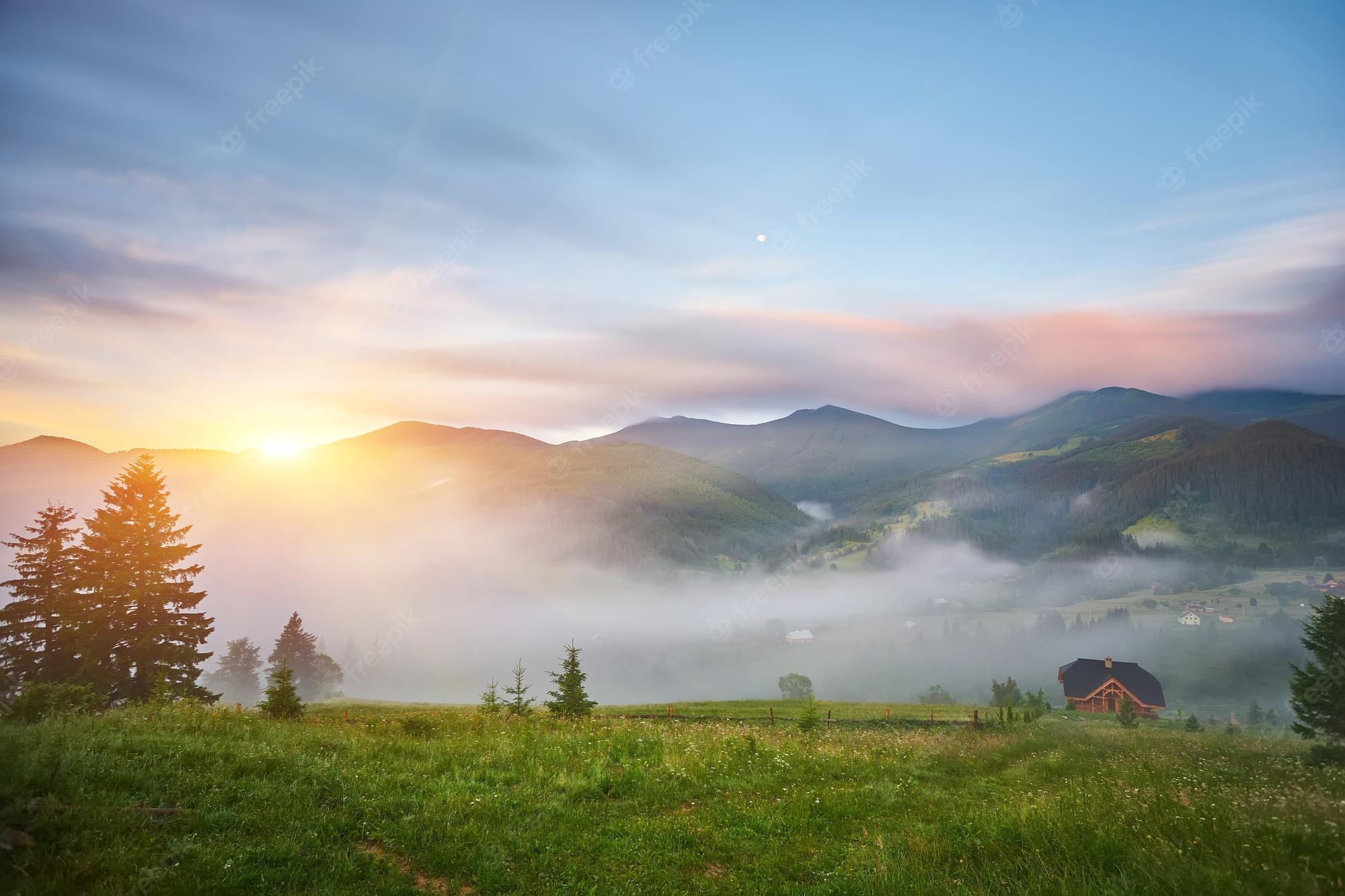 Green Grass And Fogg Under Purple Sky During Sunset Wallpapers