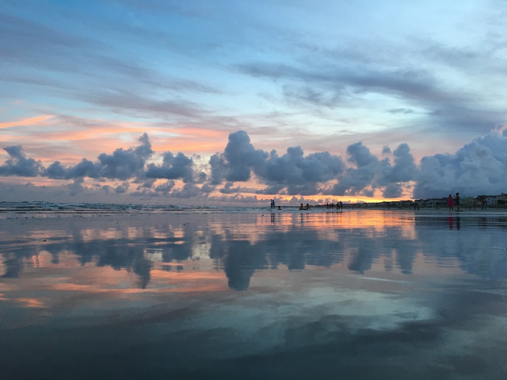 Reflection Of Cloudy Sunset Over Beach Wallpapers