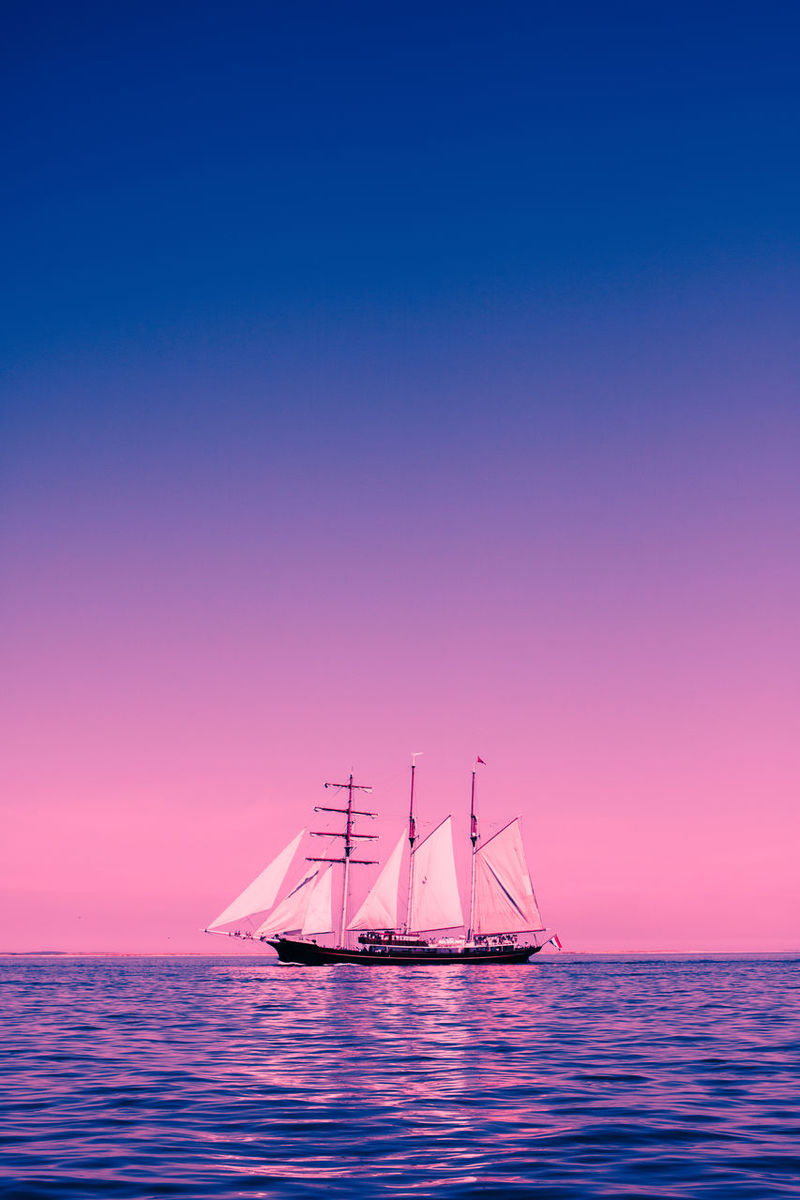 Sailing Ship In Purple Ocean Wallpapers