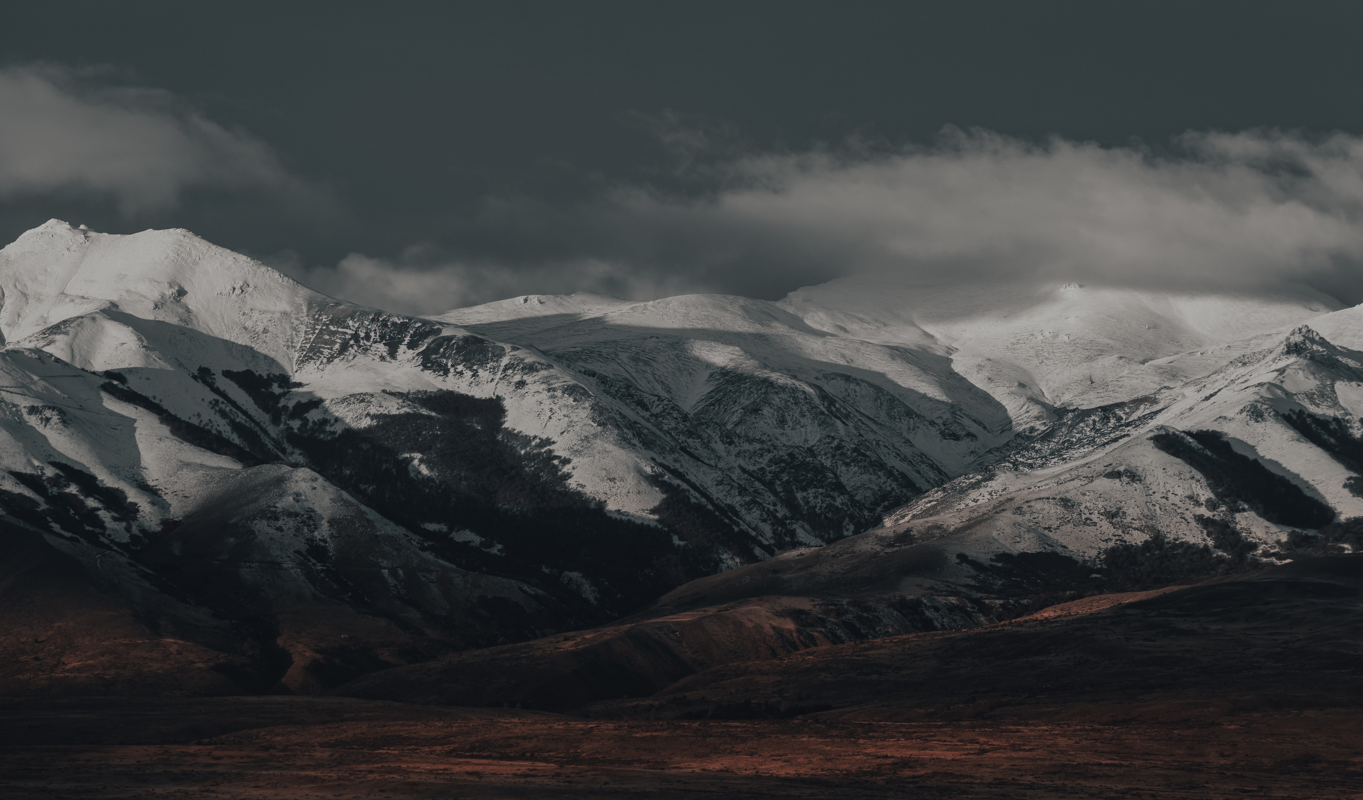 Snow Covered Mountains Under Black Cloudy Sky Wallpapers