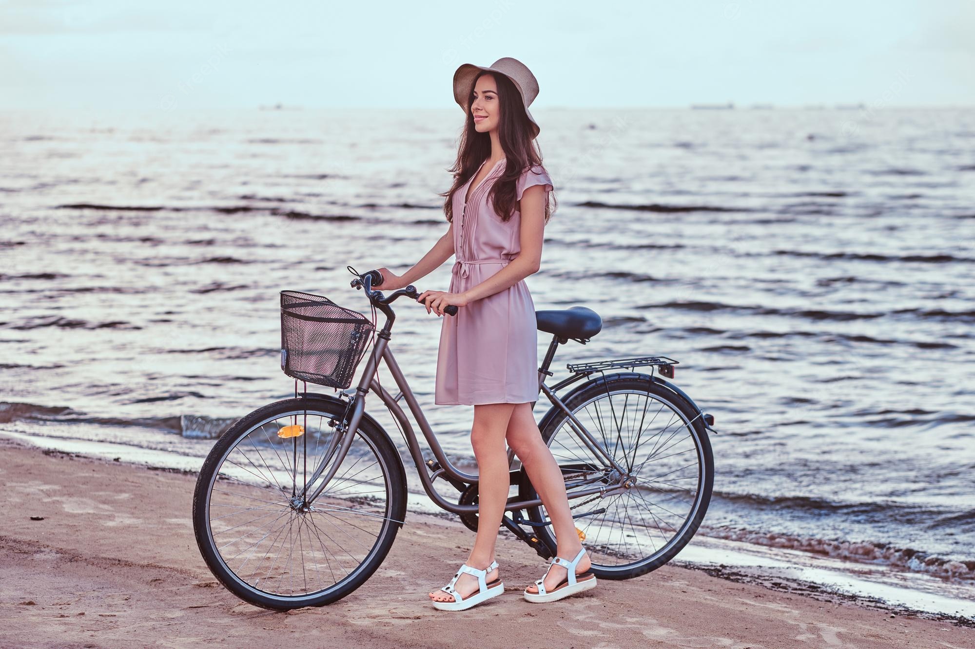 Girl Cycling Near Sea 4K Wallpapers