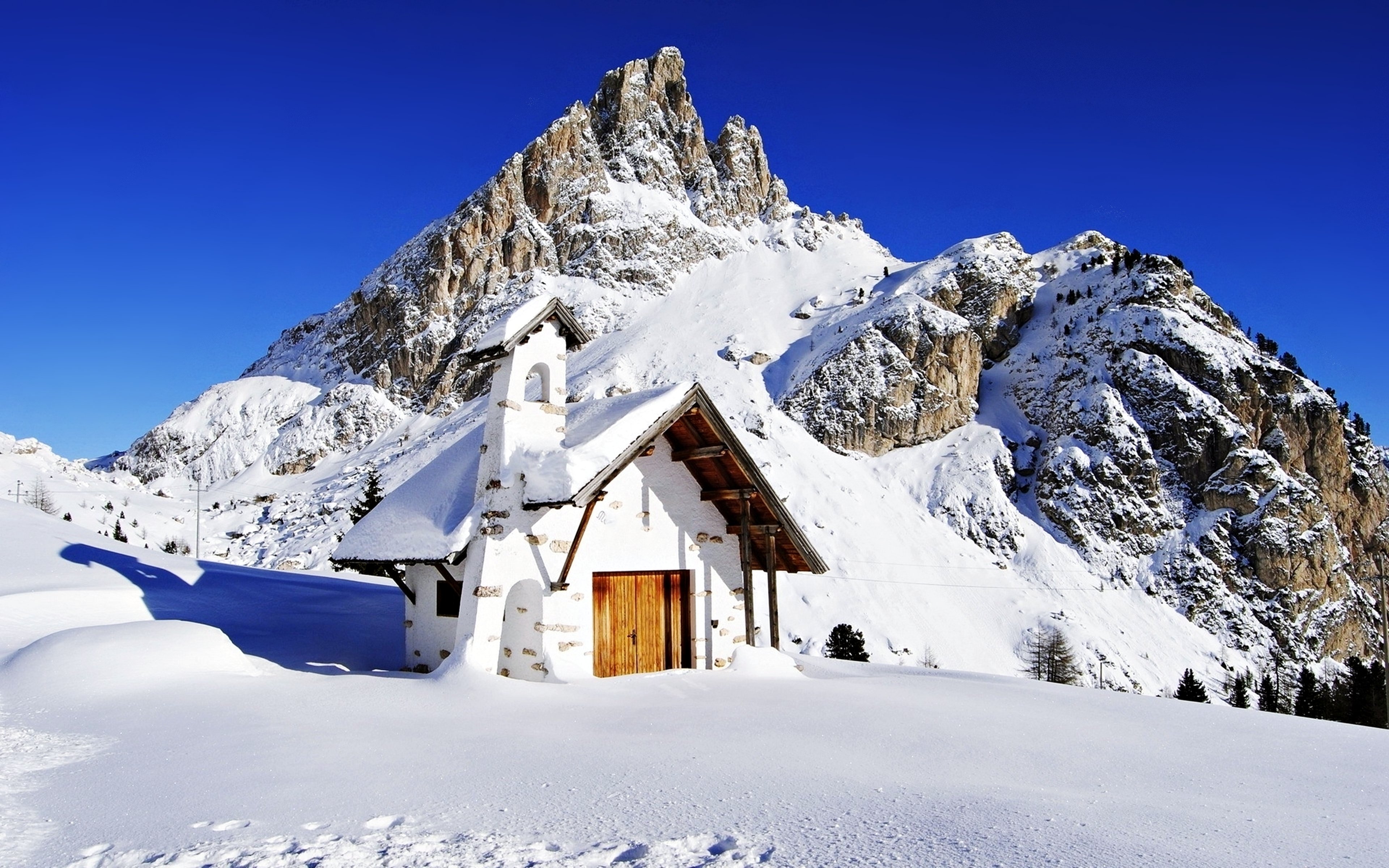 Snowy House In Mountains 4K Wallpapers