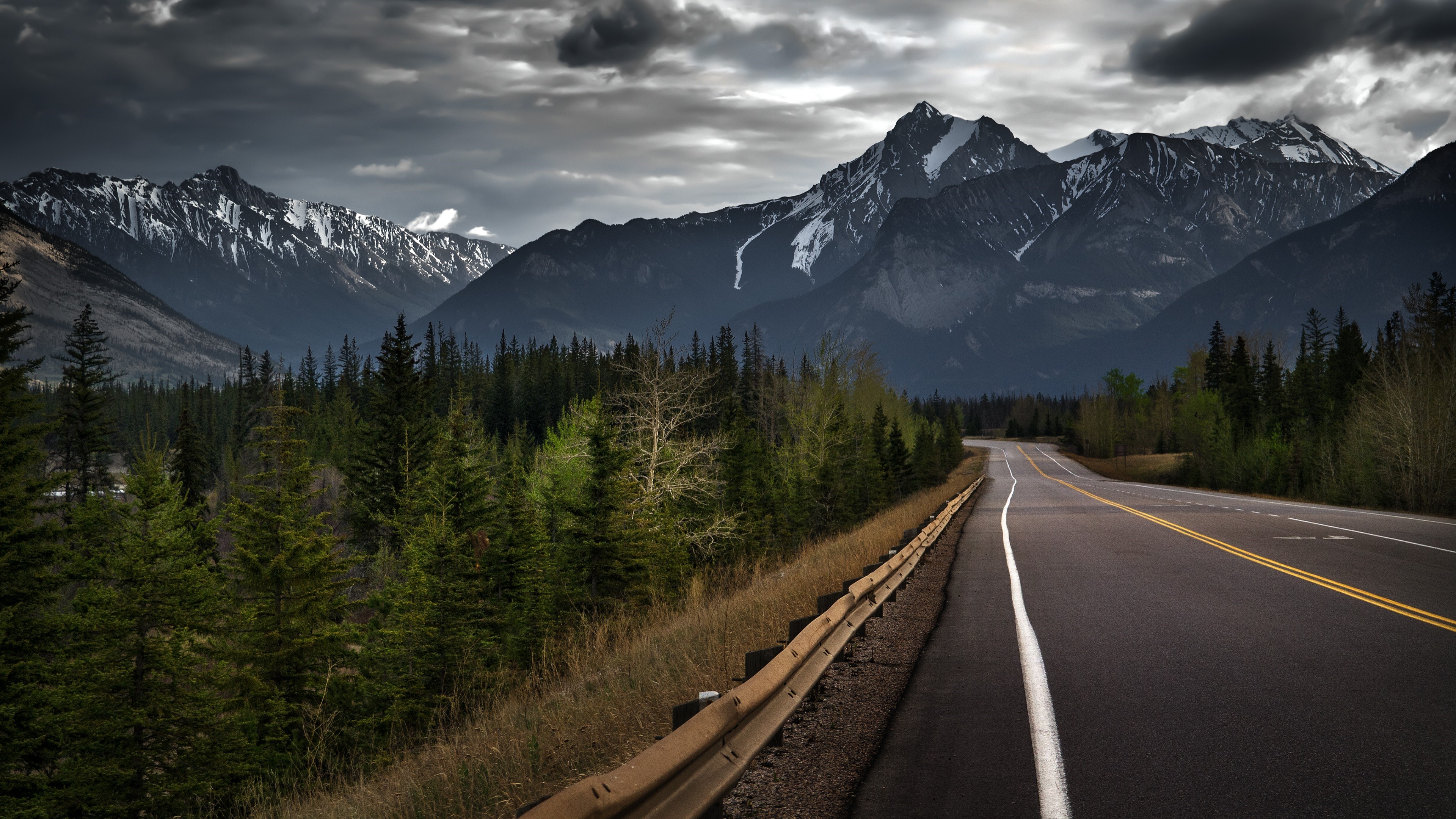 Road With Background Of Mountains And Clouds