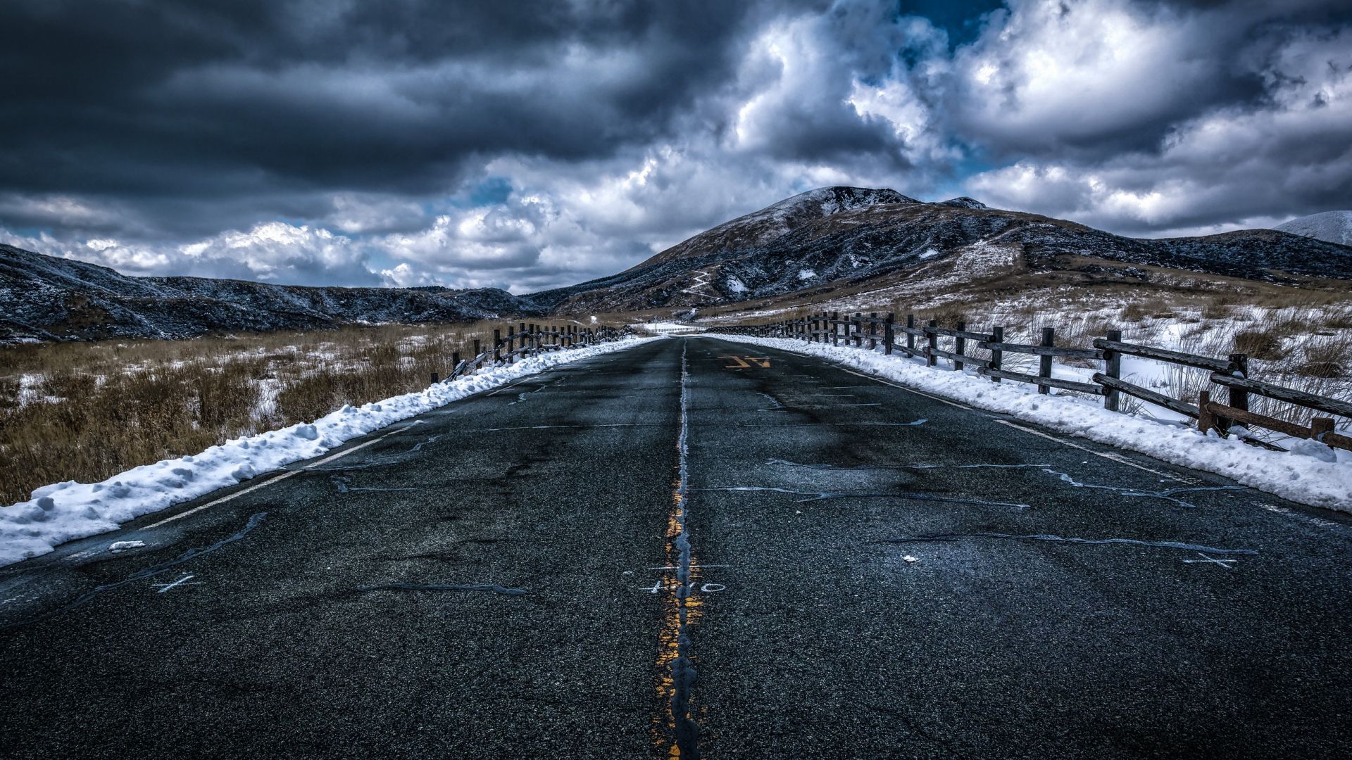 Road With Background Of Mountains And Clouds