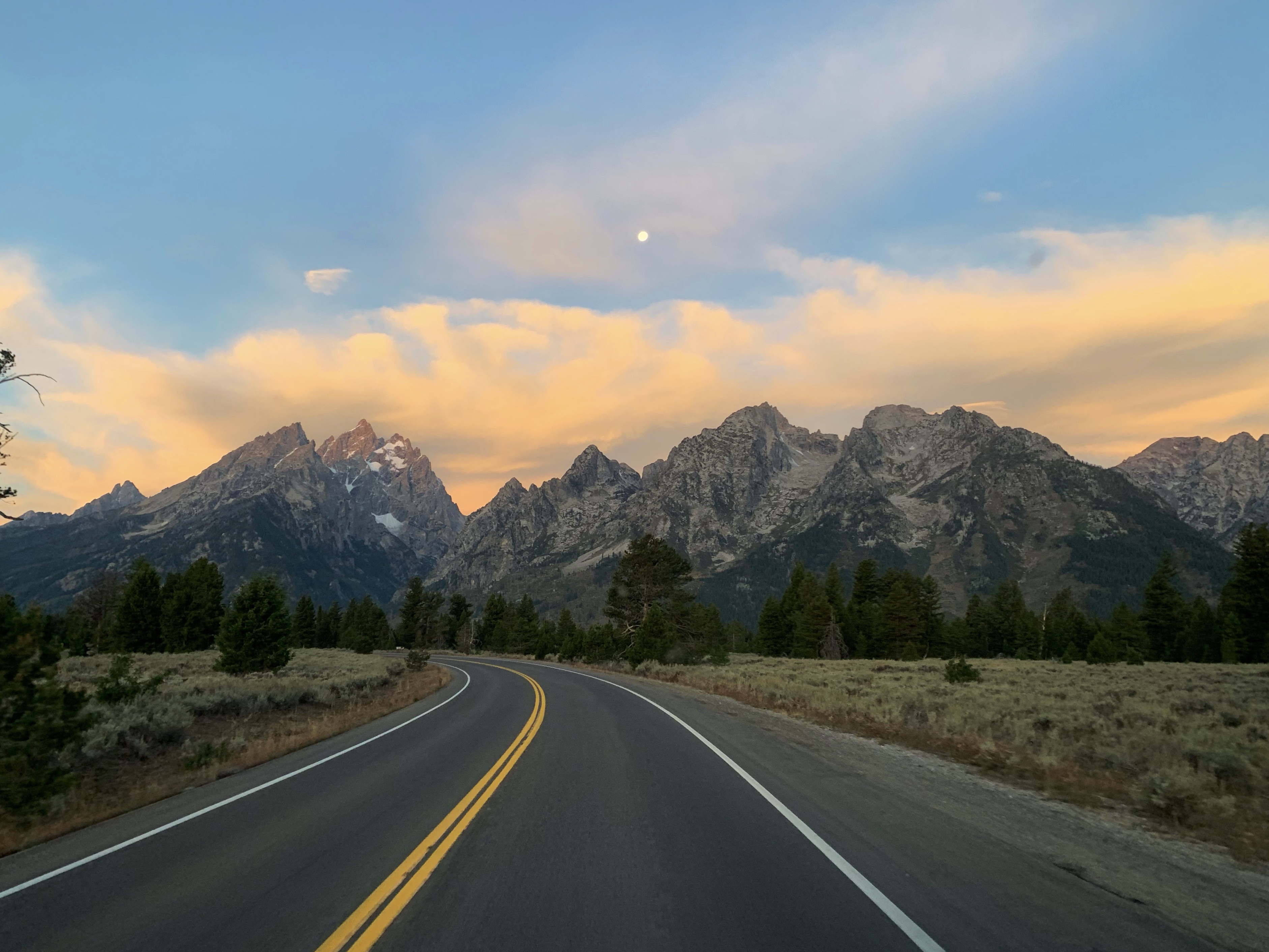 Road With Background Of Mountains And Clouds